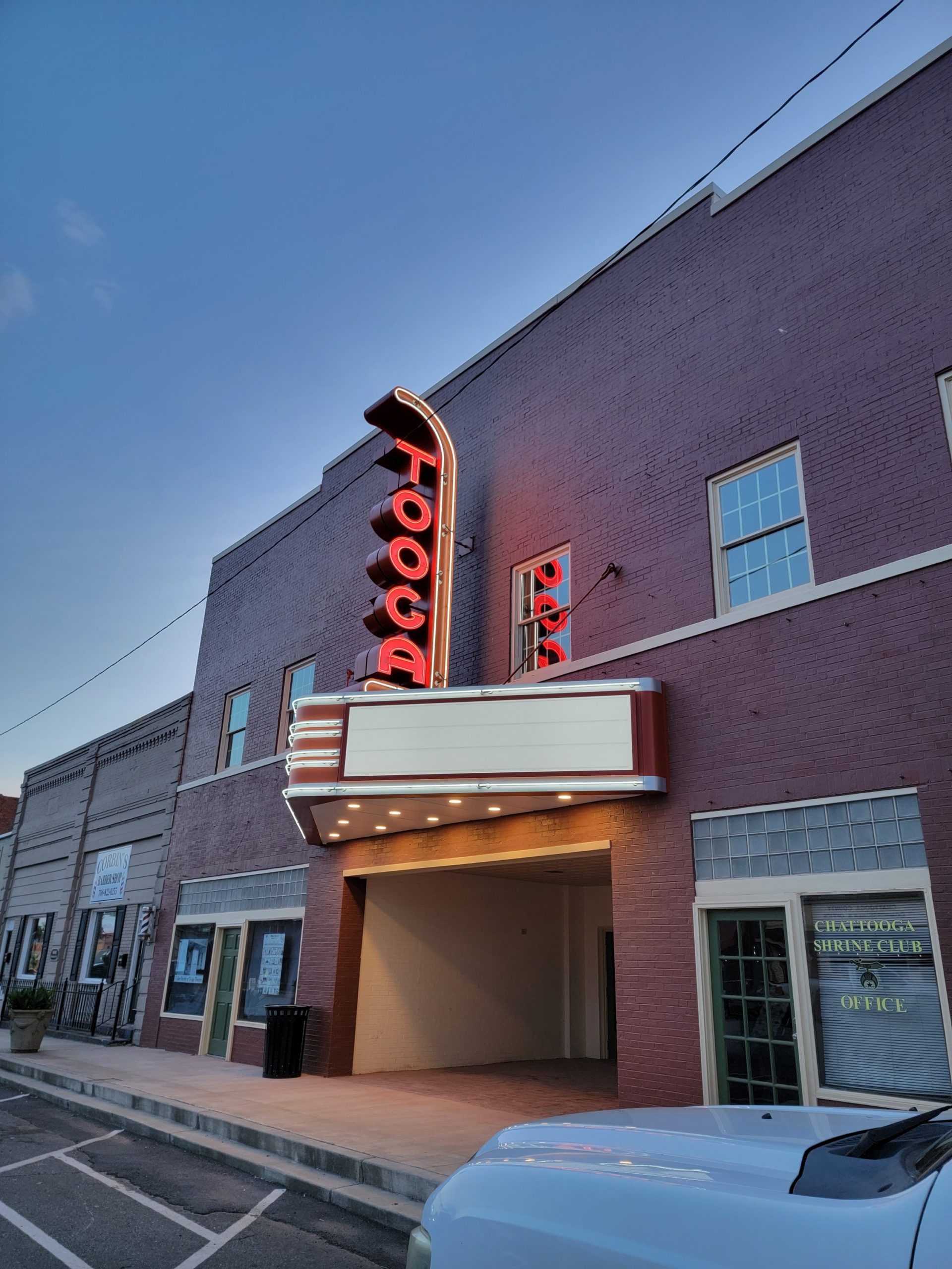 Tooga Theatre marquee sign lit up at night | Marquee restoration work by Wagner Electric Sign Co.